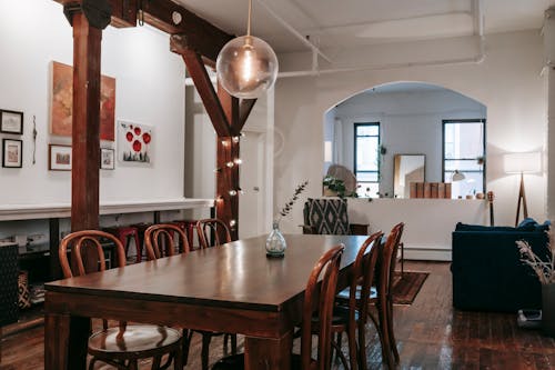 Dining table near wooden beam