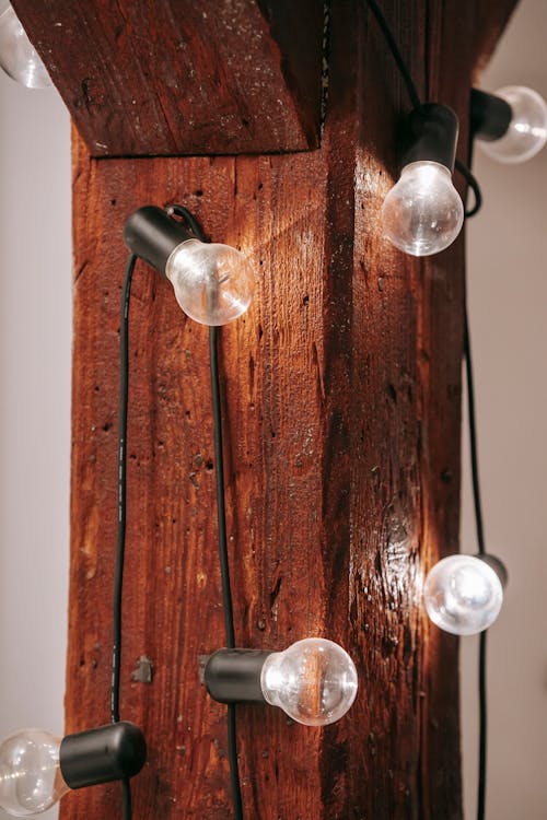 Glowing lamps on wooden board