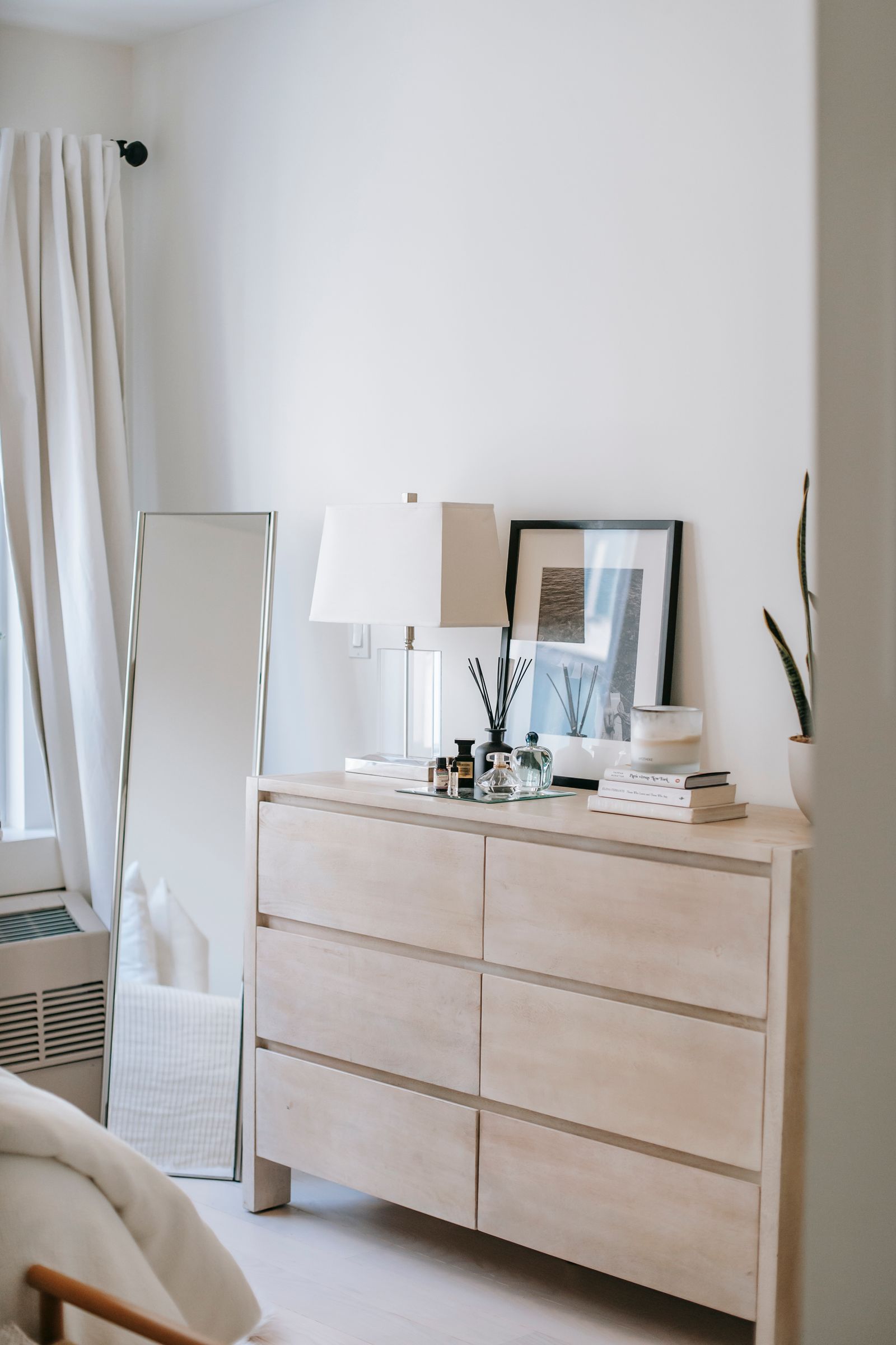 Styled home decor with ceramics, textiles, and warm neutral tones