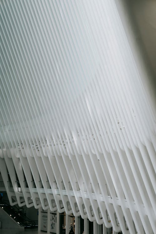 White geometric roof of contemporary building above hallway