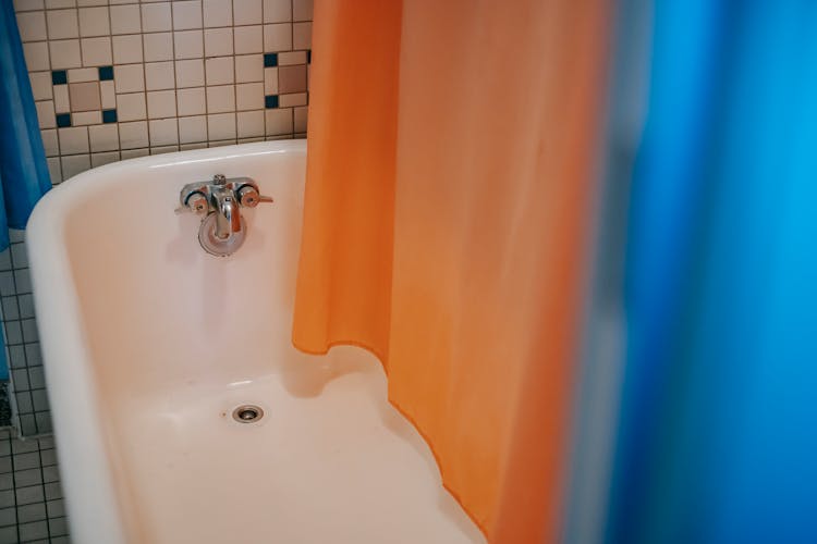 Interior Of Modern Bathroom With Colorful Curtain