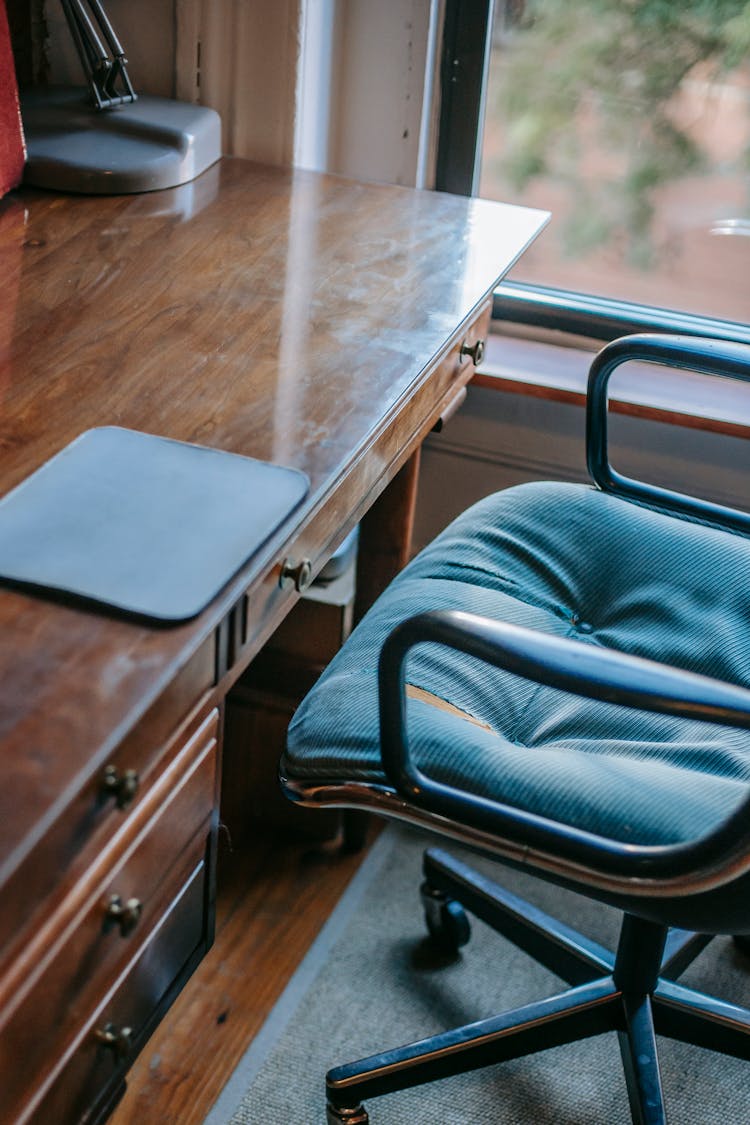 Black Graphic Tablet Pad Placed On Wooden Table In Cozy Apartment