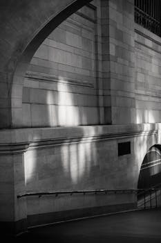 Sunlight casts dramatic patterns on the iconic walls at Grand Central Terminal, New York.