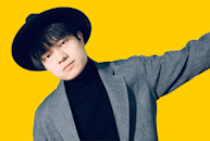 Man in Gray Blazer and Black Shirt