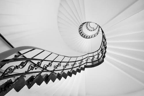 White Spiral Staircase With Black Metal Railings