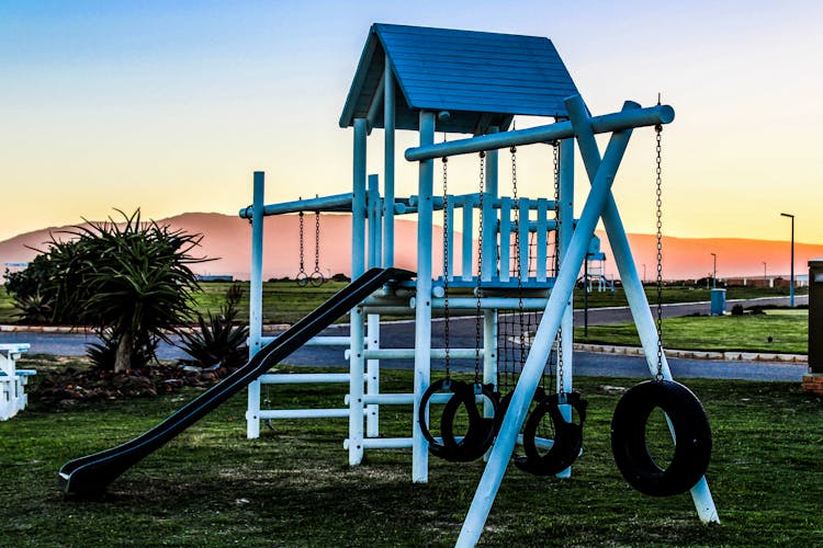 Slide And Swings In A Playground