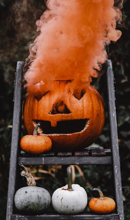 Jack O Lantern on Black Wooden Ladder