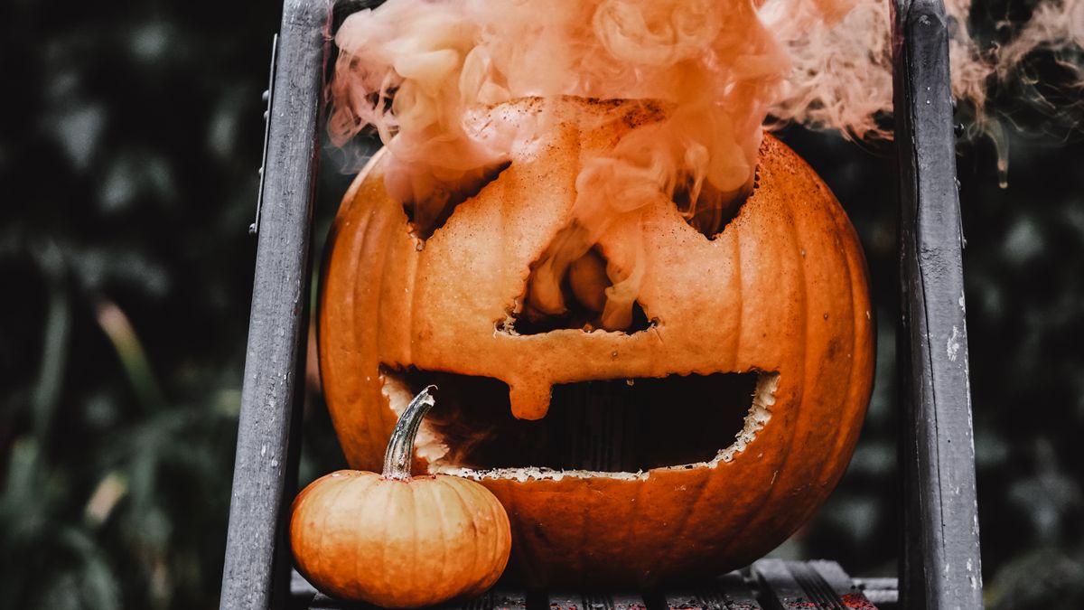Carved jack-o-lantern with swirling Halloween smoke