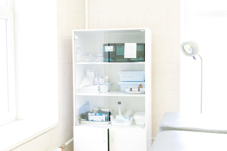 Empty White Cabinet With Medical Equipment