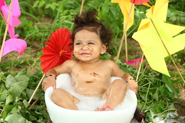 Cute Little Baby In Bath Outdoors