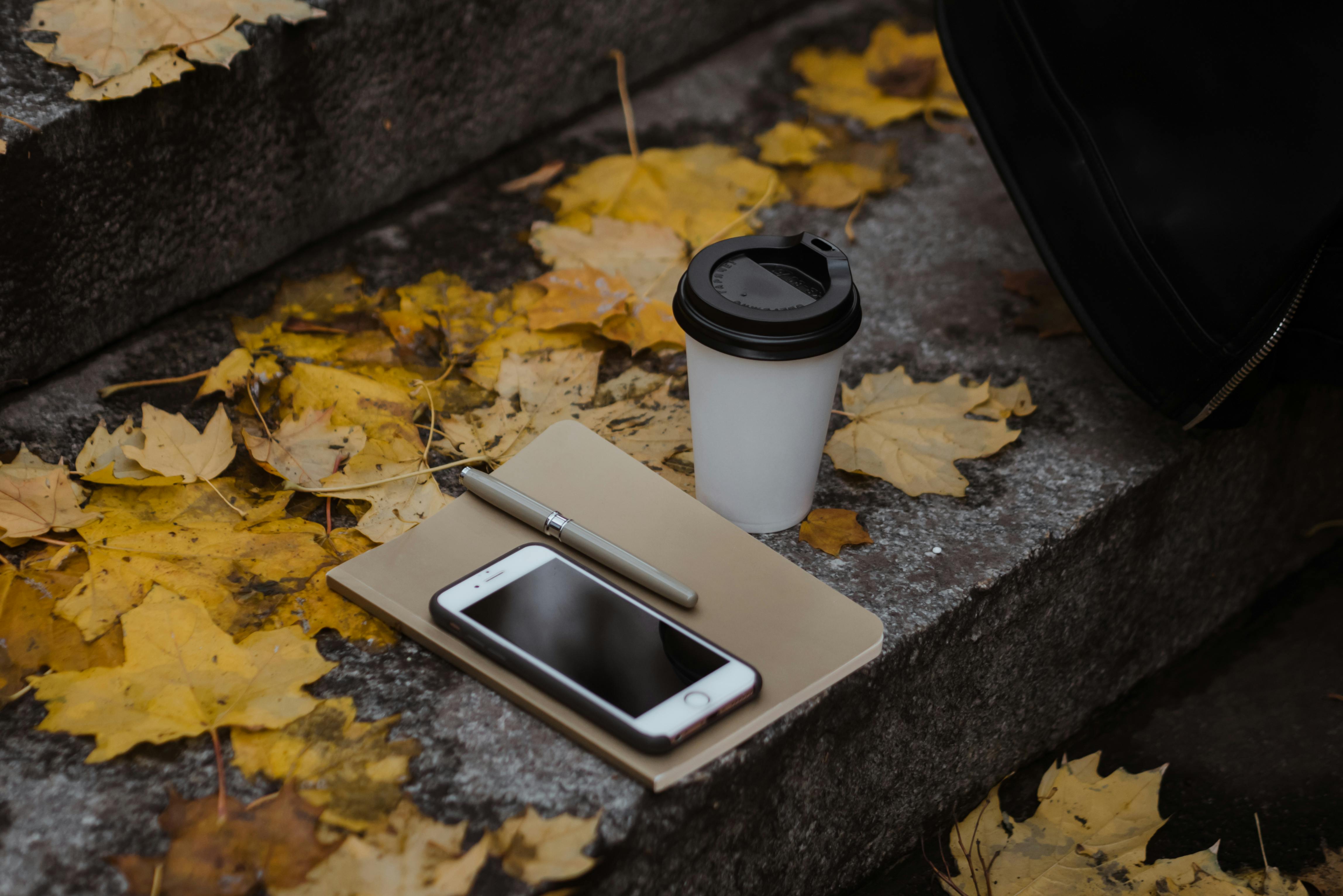 white and black plastic cup on white tray