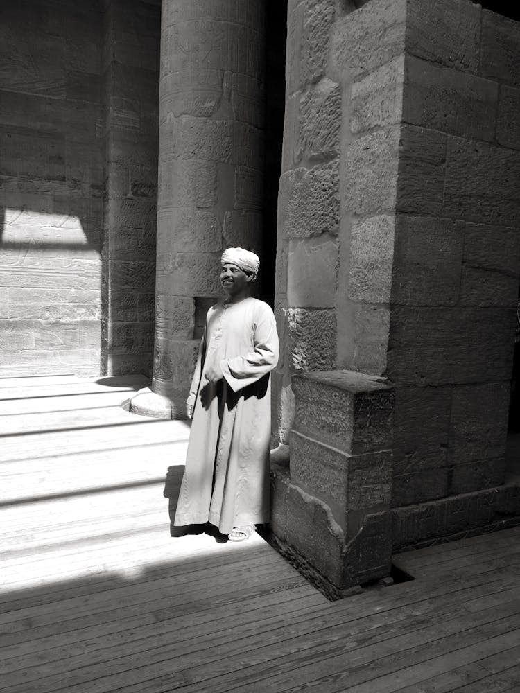 Man Wearing Traditional Clothing In Historical Building