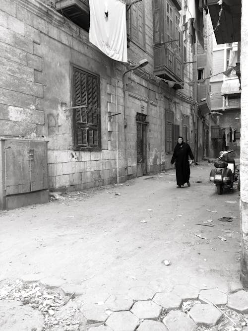 Person Walking in an Alley