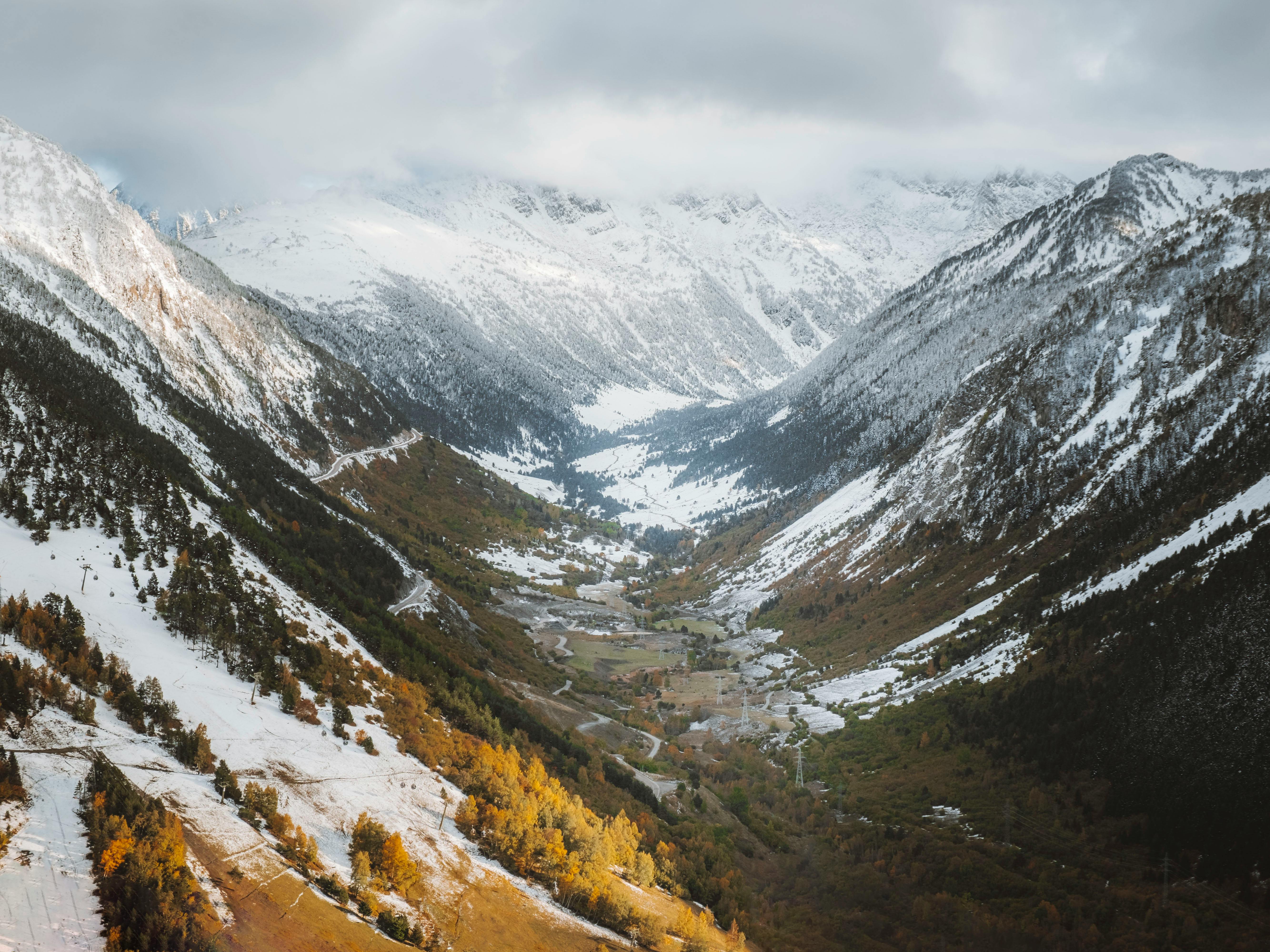 A stunning winter view of the snow-covered valley in Baqueira, capturing the serene beauty of the Pyrenees mountains.
