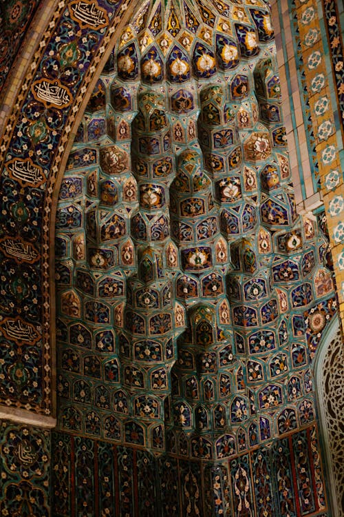From below interior detail of portal of ancient Saint Petersburg Mosque with rich decorated ornamental walls