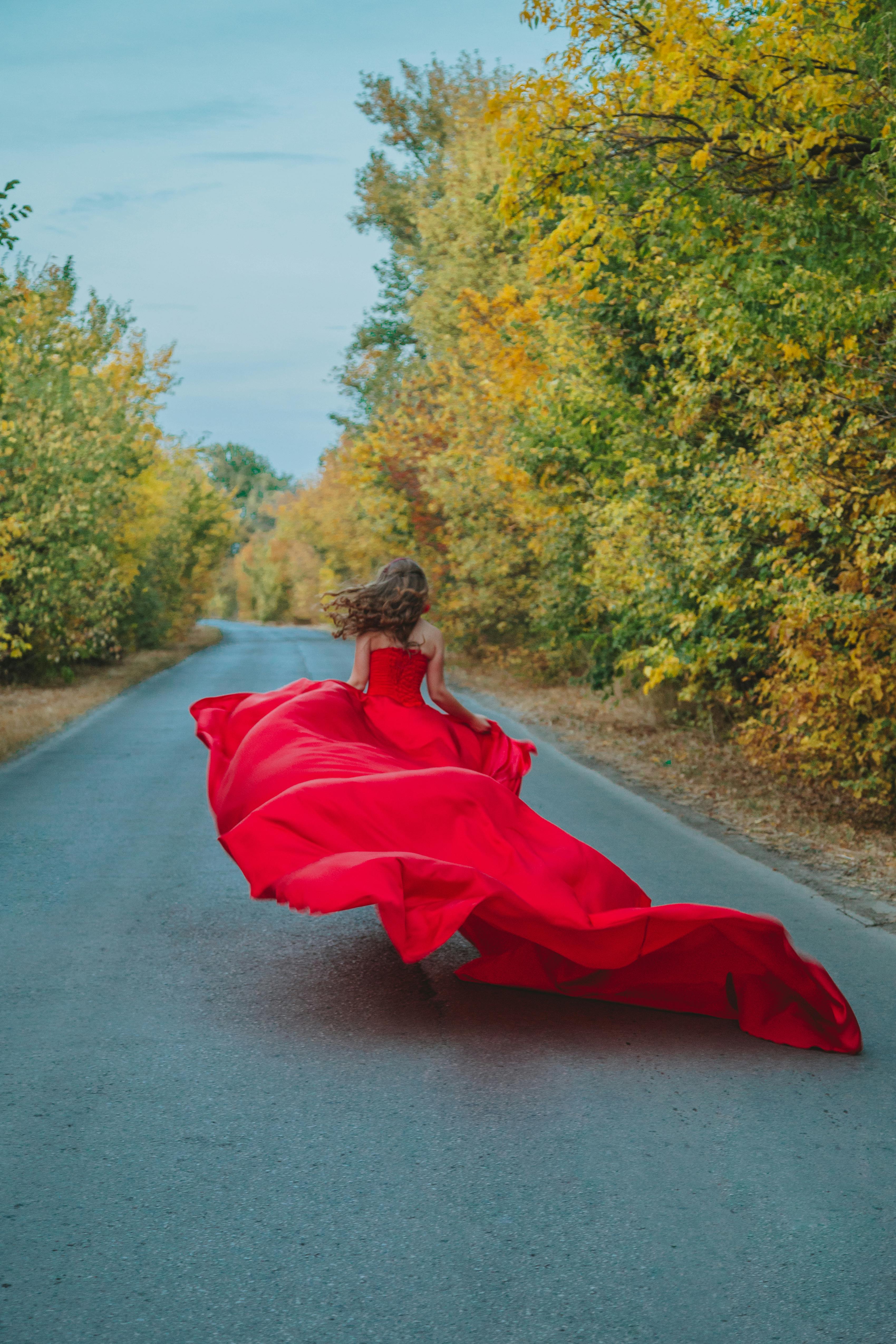 woman in red dress running