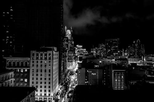 Black and White View of City at Night with Modern Skyscrapers