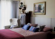 White and Pink Floral Pillow on Bed