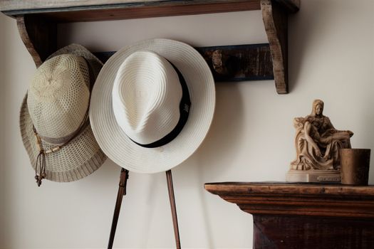 White Fedora Hat on Brown Wooden Table