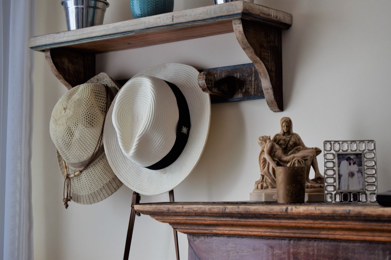 vintage wooden shelf with summer hats and decorative items in brazilia