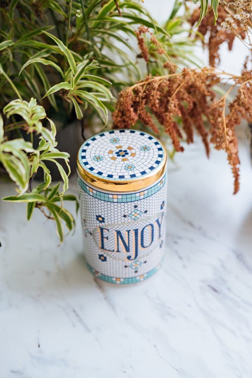 Free White and Blue Can on White Table Stock Photo