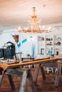 A Wooden Table Under an Illuminated Wooden Chandelier