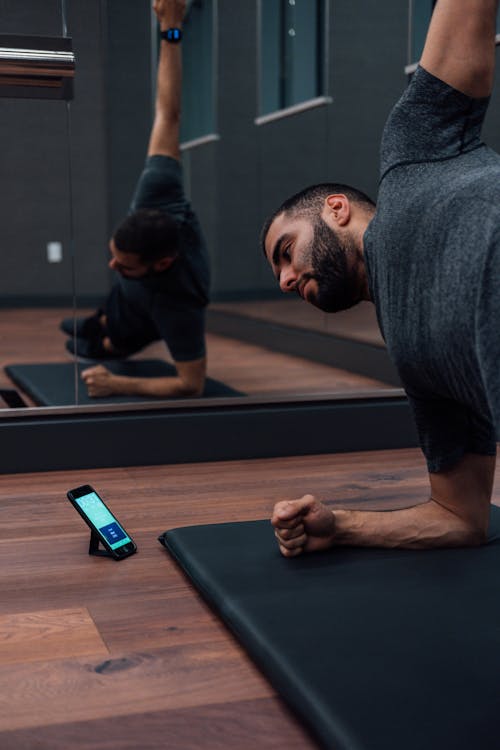 Man in Gray Crew Neck Exercising