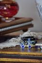 Blue and Silver Ring on Brown Wooden Table