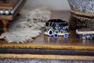 Blue and Silver Round Ornament on Brown Wooden Table