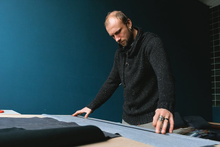 Man Measuring Fabric 