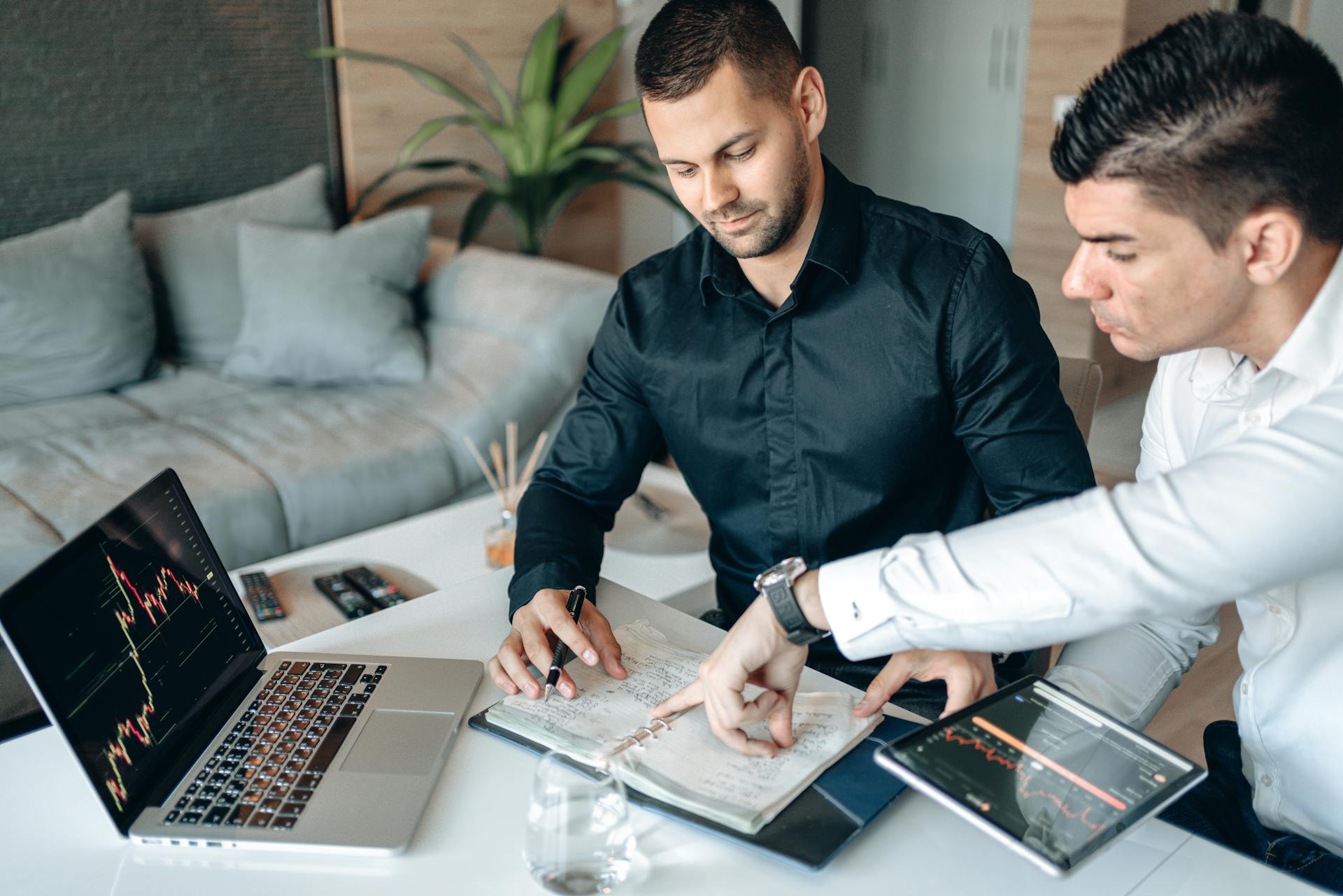 Men Analyzing Charts of Cryptocurrency