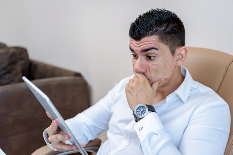 Man In White Dress Shirt Holding Tablet 