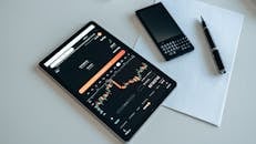 Tablet, Phone and Pen on White Table