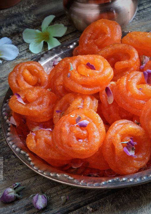 Janmashtami 2026: Eggless Prasad Recipes and Traditional Sweets for Krishna's Birthday 1 Clay pots filled with white butter and mishri crystals arranged on a wooden surface for Janmashtami offering