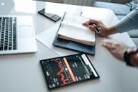 Person Holding a Notebook