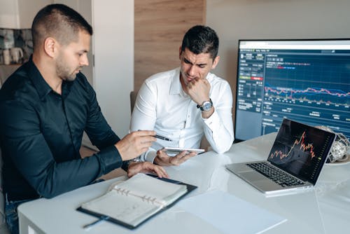 Free Men Discussing in Office Stock Photo