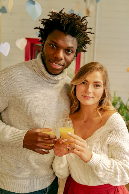 Free A Couple Wearing Knitted Sweaters Stock Photo