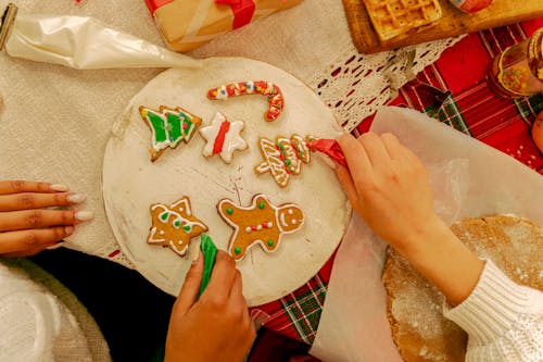 Free A People Decorating a Gingerbreads Stock Photo
