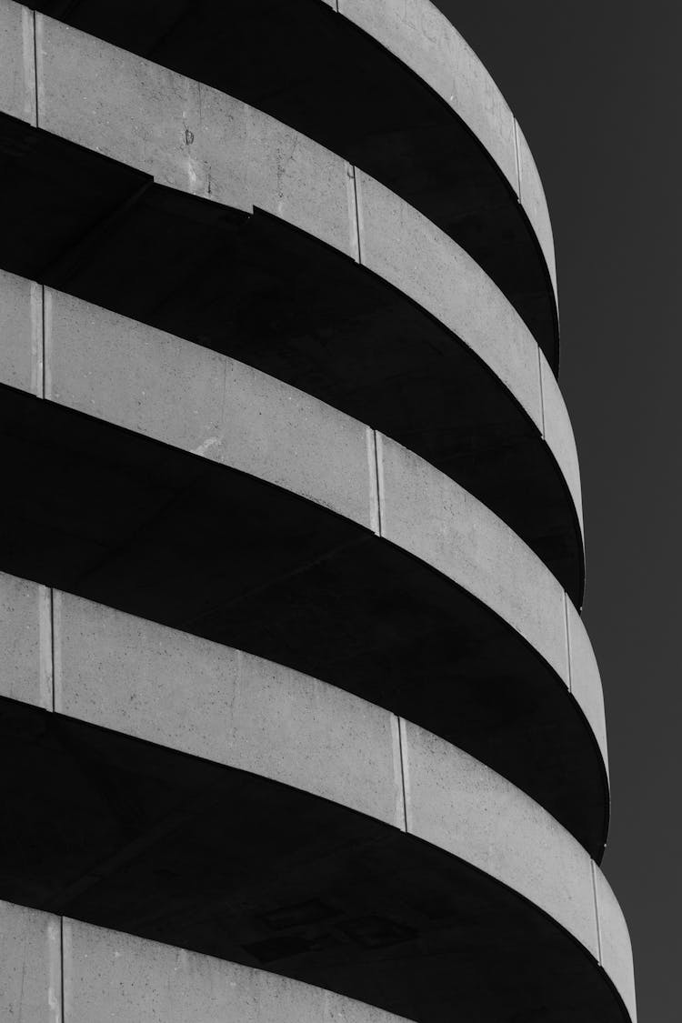 Black And White Photo Of A Curved Building