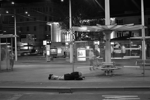 Free A dramatic night scene in black and white at a bus stop in Graz, Austria. Stock Photo