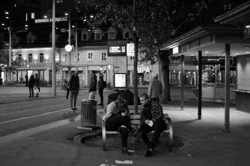 Free Black and white street scene of people socializing at night in Graz, Austria. Stock Photo