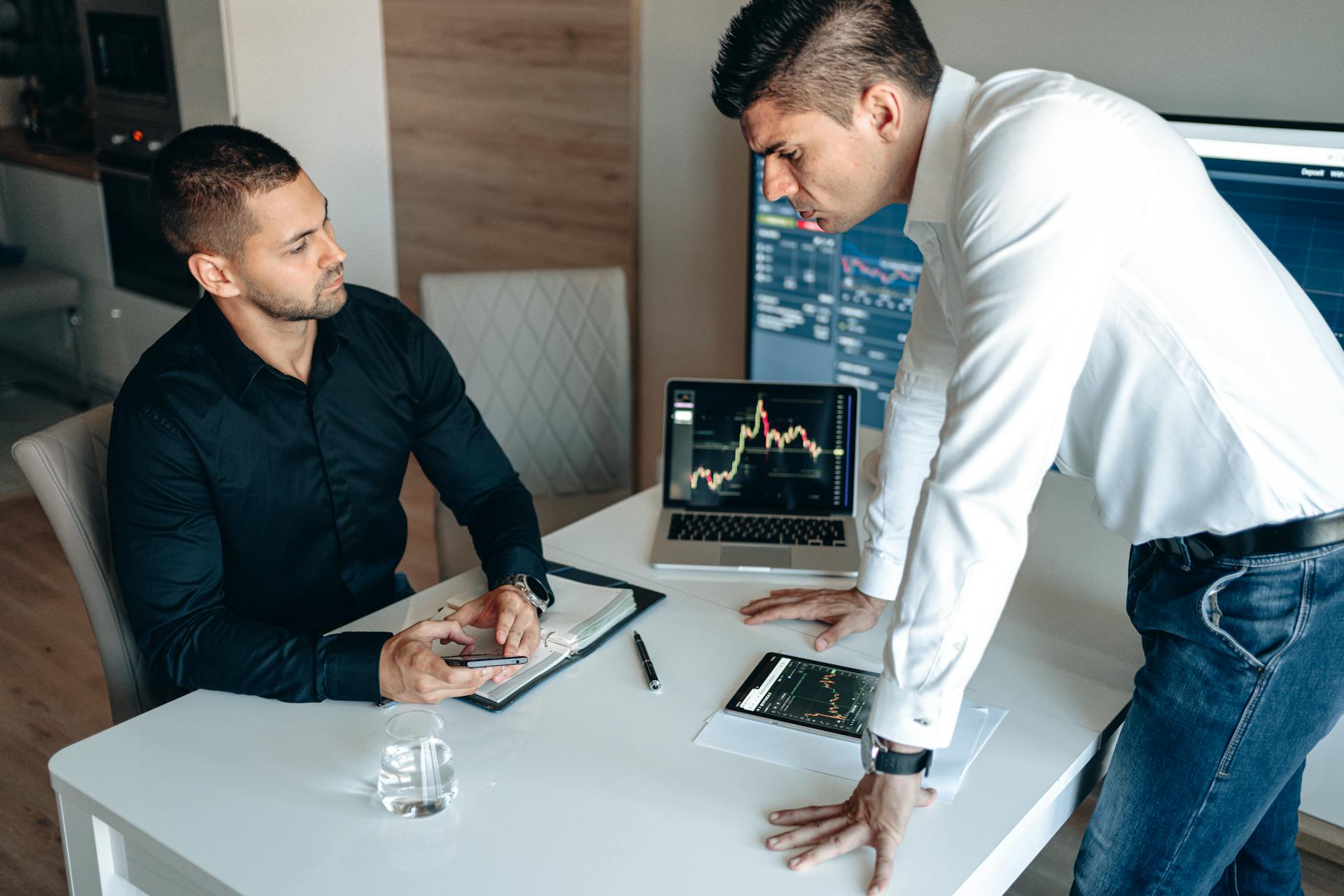 Men Checking Data on Stock Market