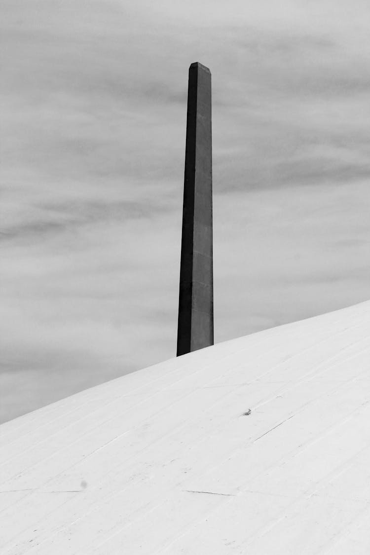 Black And White Photo Of An Obelisk 