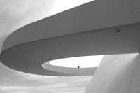 A curved concrete canopy in monochrome. Photo by EUGENIO BARBOZA on Pexels