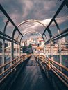 A Bridge with Metal Railings Under Cloudy Sky