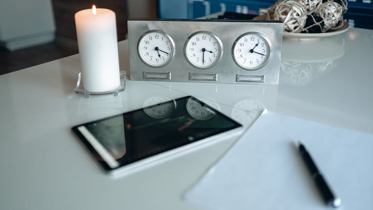 White Analog Clocks On Gray Frame