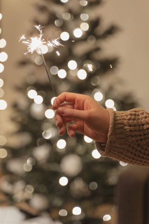 Person Holding a Sparkler 