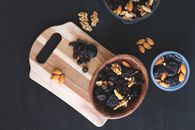 Brown Wooden Chopping Board With Black and Brown Nuts