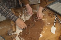 Person Holding Brown Wooden Table