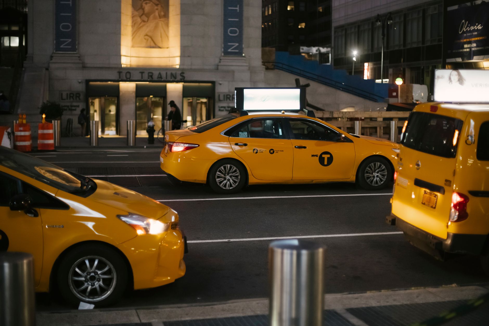 Taxi Vehicles Riding On City Street In Evening Free Stock Photo taxi-vehicles-riding-on-city-street-in-evening-free-stock-photo